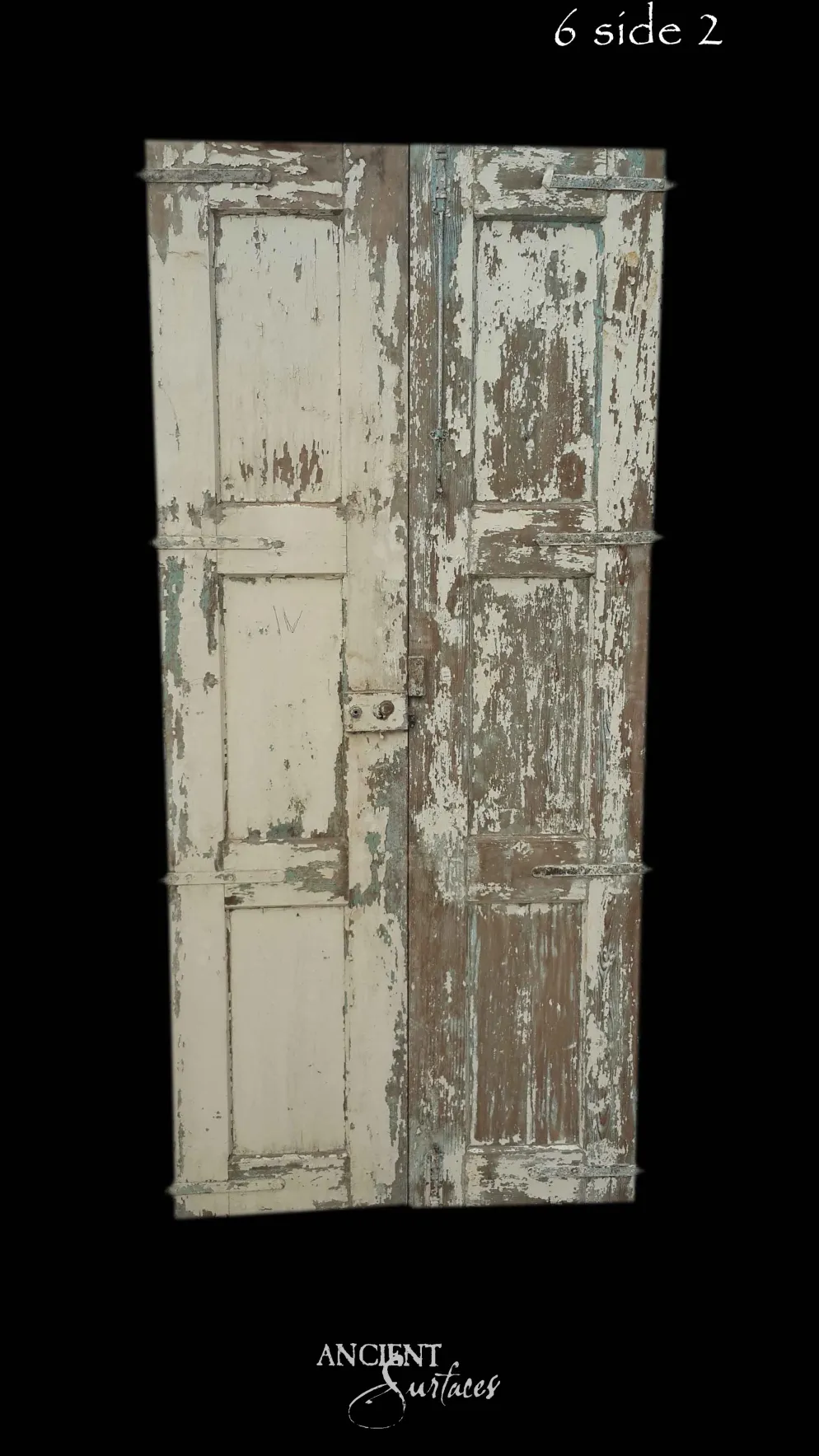 Layered taupe-and-cream reclaimed antique double door with three raised panels and an iron lock plate